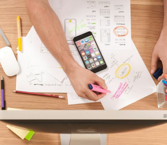 K-디자인에 AI 도입 적극 지원…글로벌 디자인 혁신 이끈다 person writing on white paper