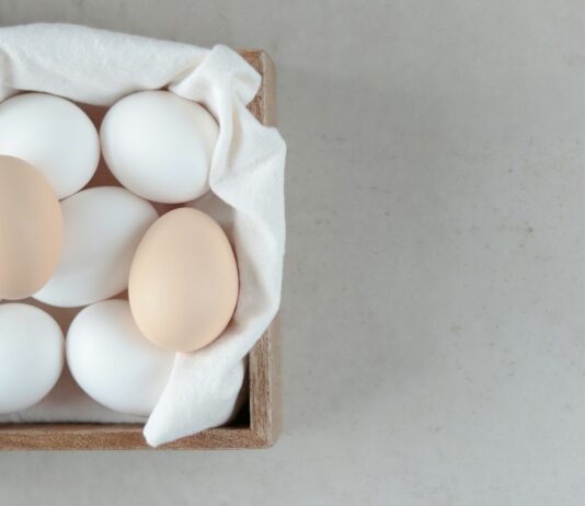 단백질 섭취, 건강한 근육 형성의 필수 요소 a wooden box filled with eggs on top of a table