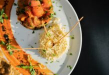 효율적인 다이어트를 위해서는 식사와 운동의 조화 a white plate topped with meat and rice