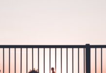 ‘근육이 곧 건강’—일상 속 근육 관리, 이제는 필수 습관입니다 silhouette of person walking on roadside during sunset